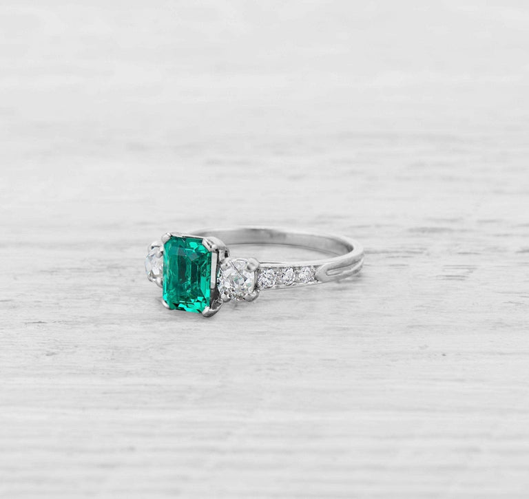 1.00 CARAT ART DECO EMERALD AND DIAMOND RING