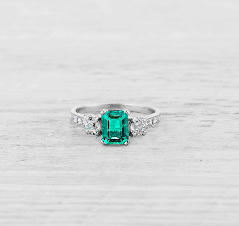1.00 CARAT ART DECO EMERALD AND DIAMOND RING