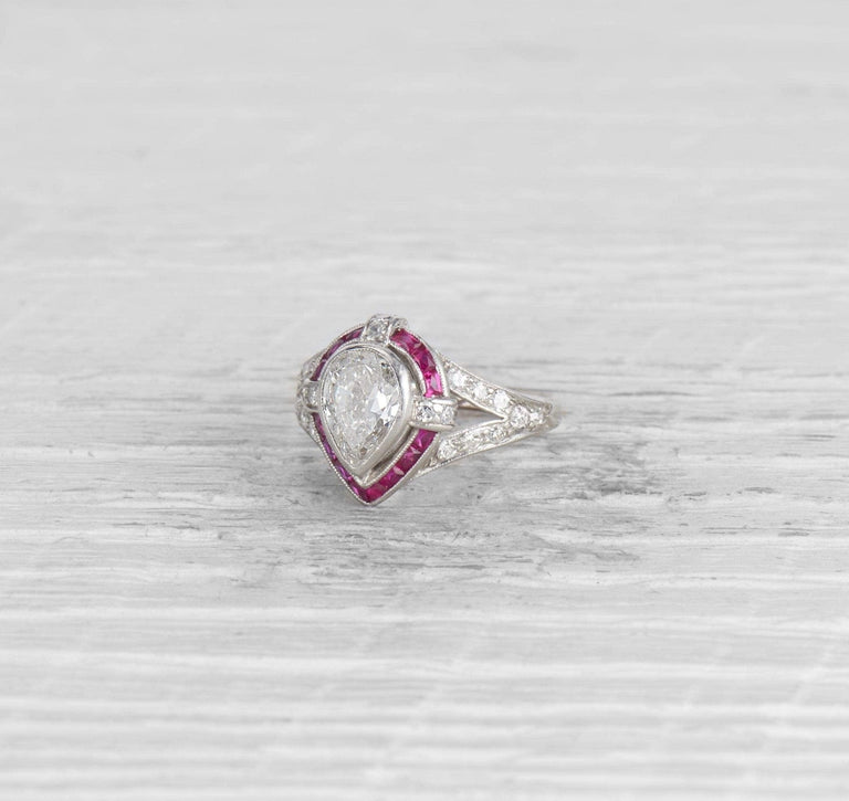 1.00 CARAT ART DECO PEAR DIAMOND AND RUBY ENGAGEMENT RING