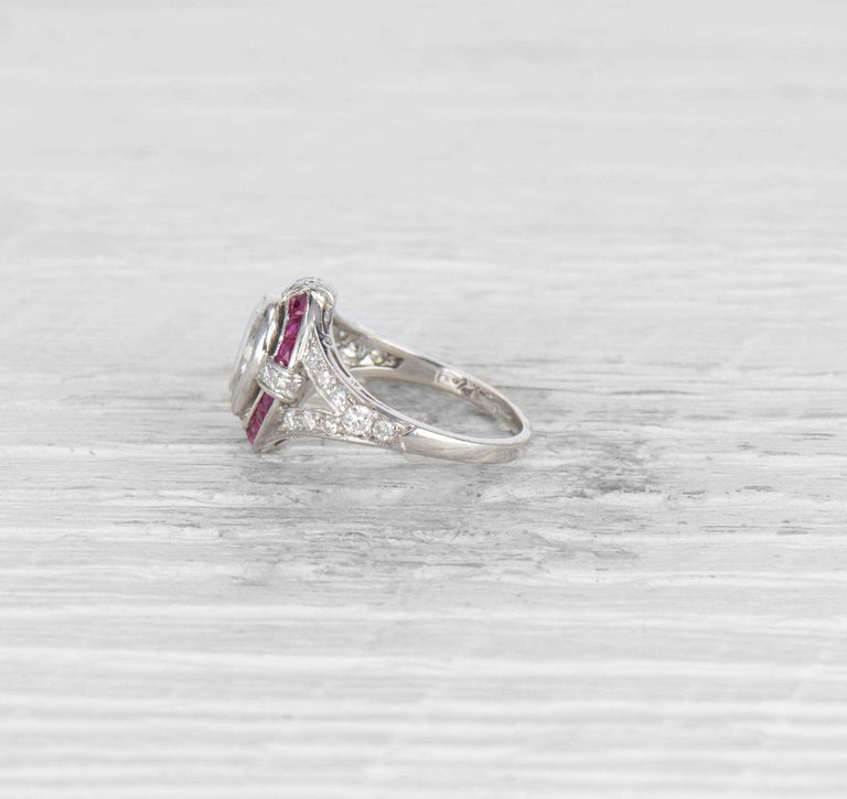 1.00 CARAT ART DECO PEAR DIAMOND AND RUBY ENGAGEMENT RING