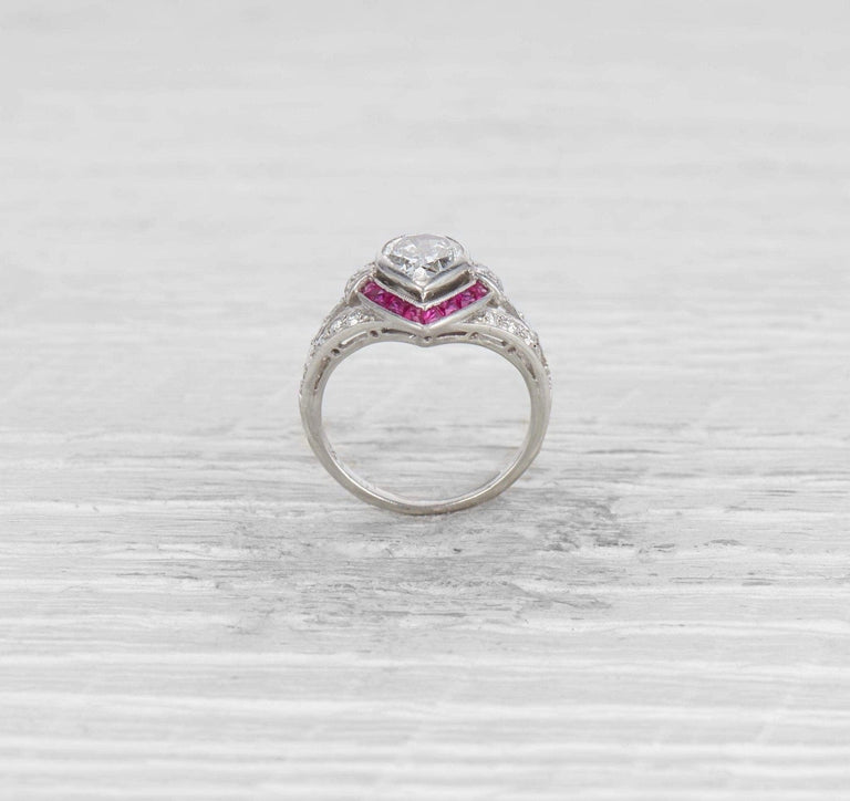 1.00 CARAT ART DECO PEAR DIAMOND AND RUBY ENGAGEMENT RING
