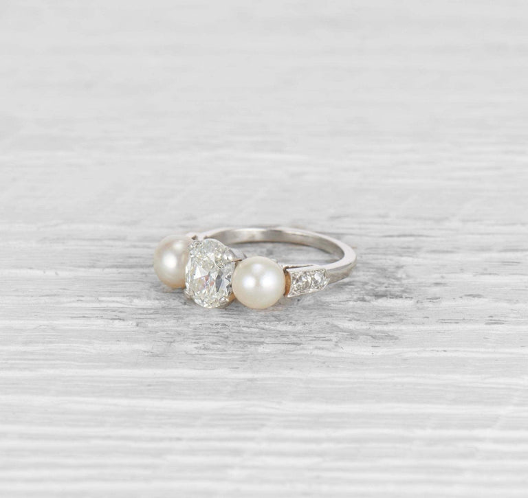 1.29 CARAT EARLY ART DECO DIAMOND AND CULTURED PEARL THREE STONE RING
