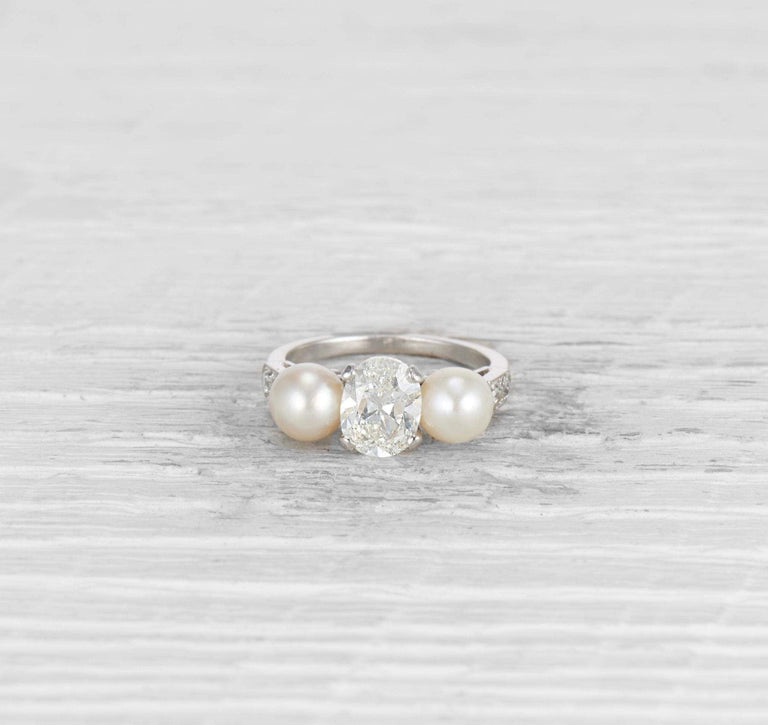 1.29 CARAT EARLY ART DECO DIAMOND AND CULTURED PEARL THREE STONE RING