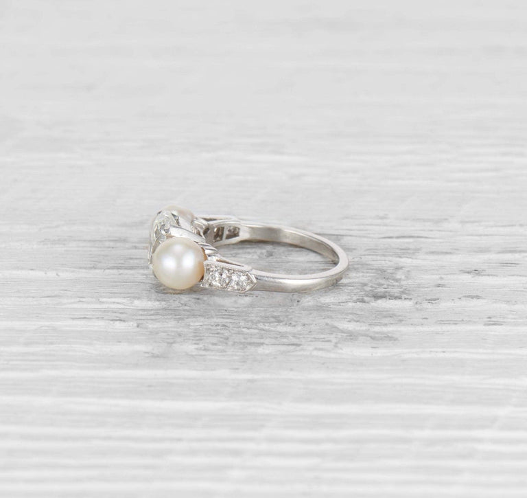 1.29 CARAT EARLY ART DECO DIAMOND AND CULTURED PEARL THREE STONE RING