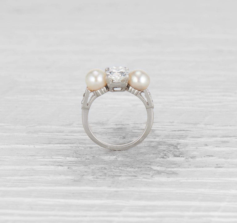 1.29 CARAT EARLY ART DECO DIAMOND AND CULTURED PEARL THREE STONE RING