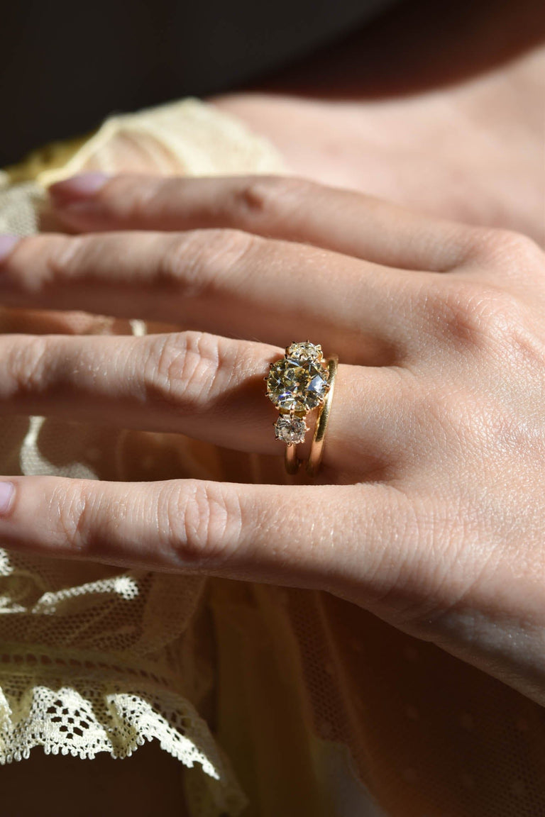 3.06ct Antique Old Mine Diamond Three Stone 18k Gold Engagement Ring | Celeste Solitaire on a hand