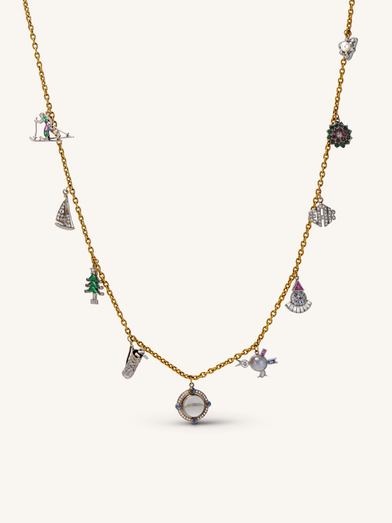 Antique Art Deco holiday-themed multi-gem platinum and 18K gold charm necklace with figural charms, circa 1920