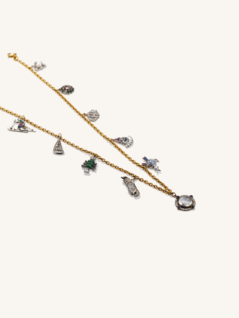 Antique Art Deco holiday-themed multi-gem platinum and 18K gold charm necklace with figural charms, circa 1920 close up
