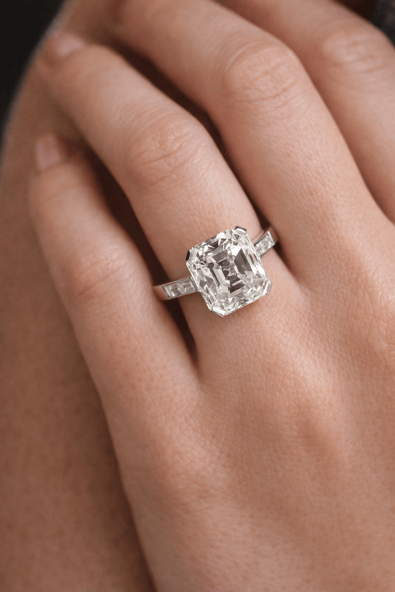 Art Deco 4.43 Carat Emerald Cut Diamond Vintage Engagement Ring on a hand