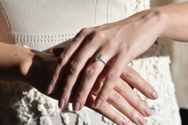 Art Deco Moval Shaped Diamond & Knife Edge Vintage Engagement Ring on a hand 2