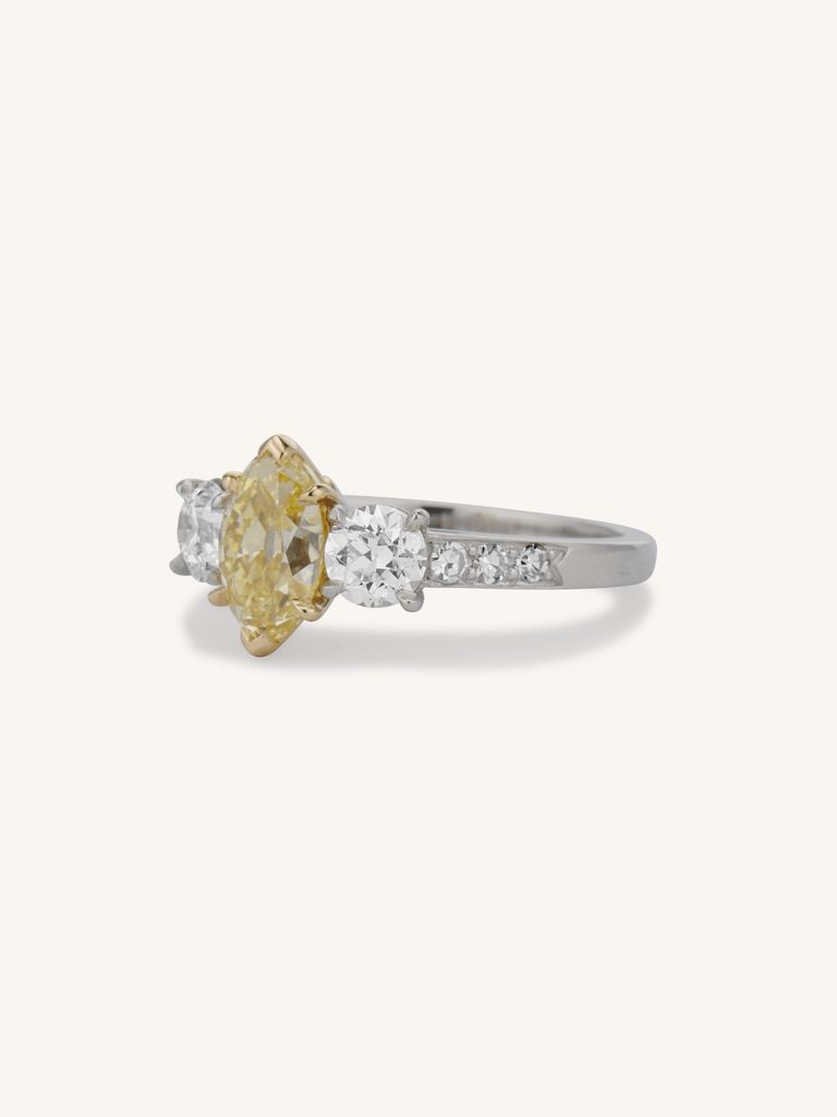Aurelia ring with 1.56ct Fancy Intense Yellow oval diamond and old European cut side stones in platinum 3/4