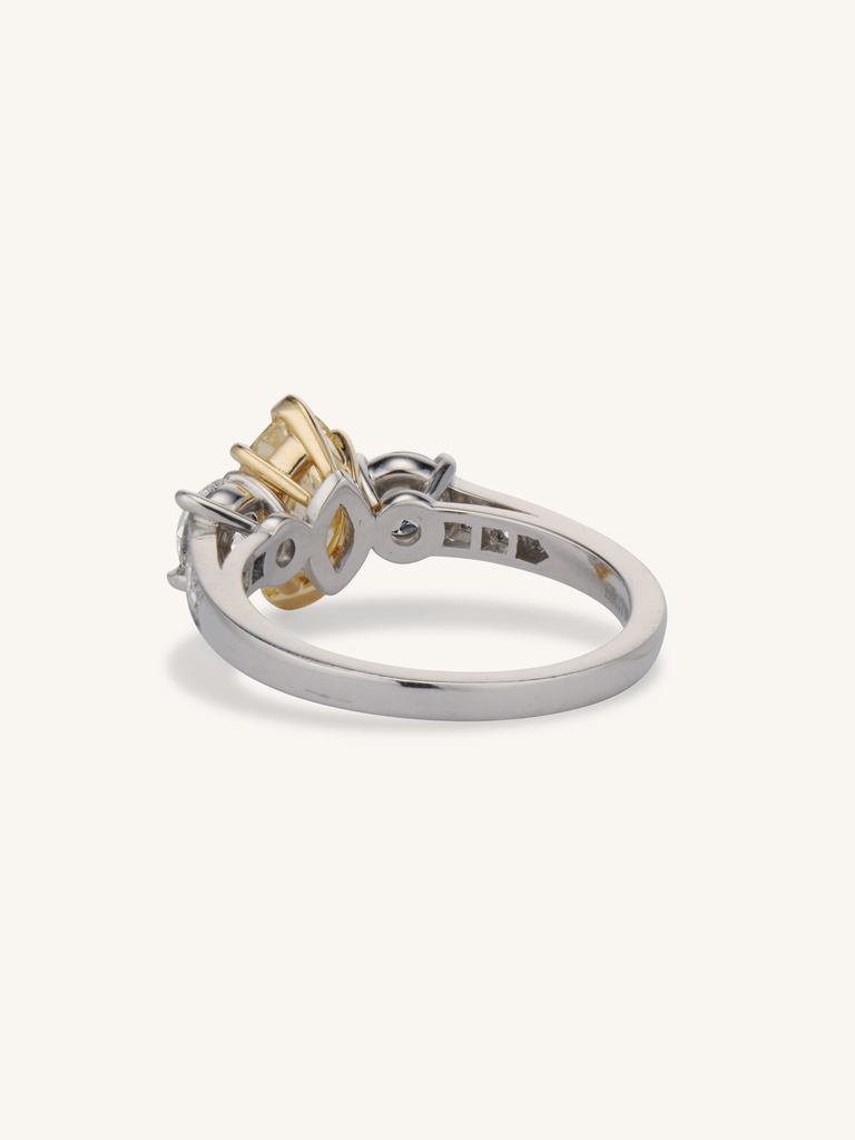 Aurelia ring with 1.56ct Fancy Intense Yellow oval diamond and old European cut side stones in platinum back