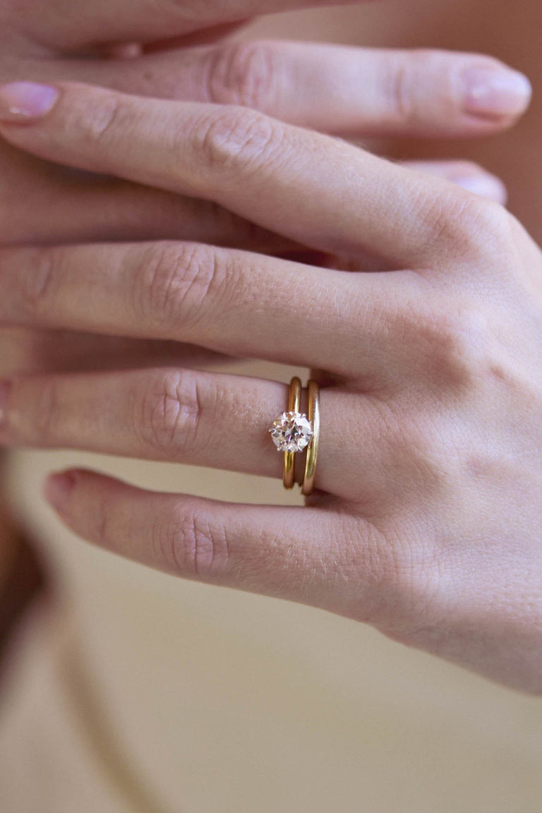 Iconic Tiffany & Co. 1.12 Carat Old European Diamond Vintage Solitaire Engagement Ring - on a hand with band