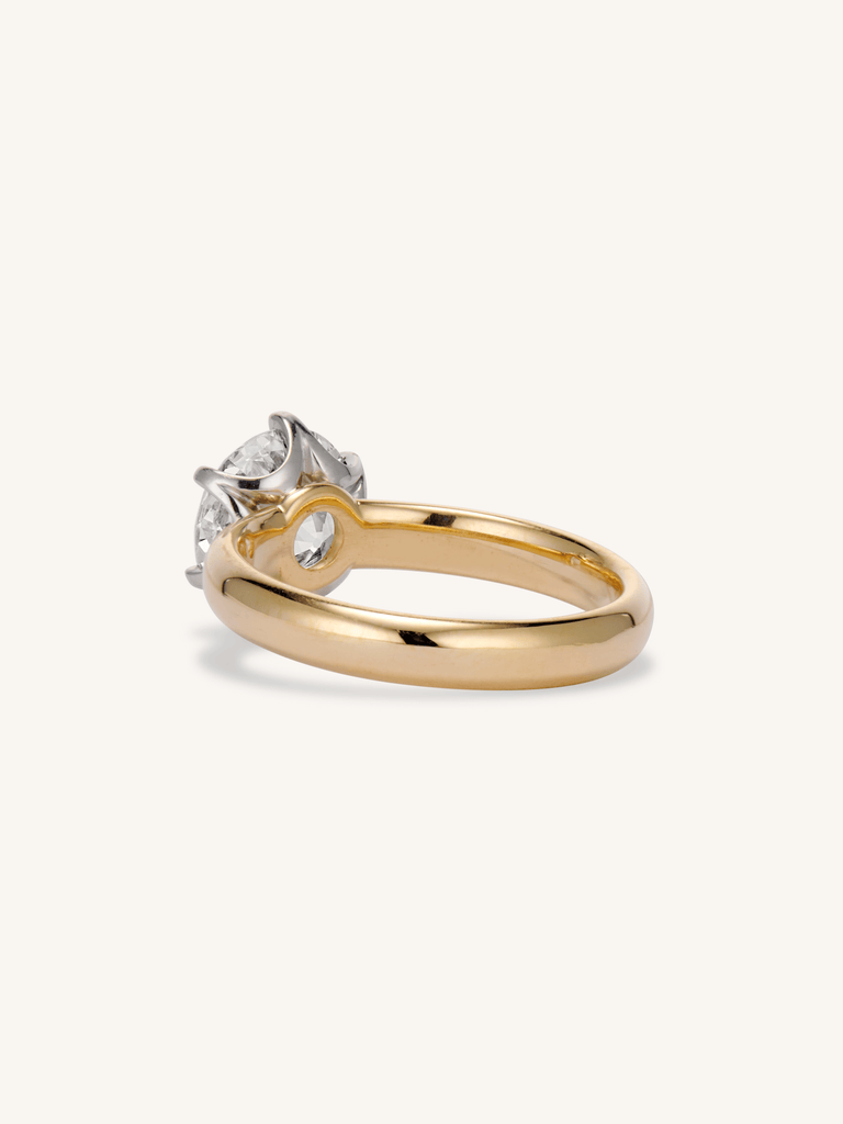 Seren 1.80ct old European cut diamond solitaire ring with low-profile setting in yellow gold on a hand - back