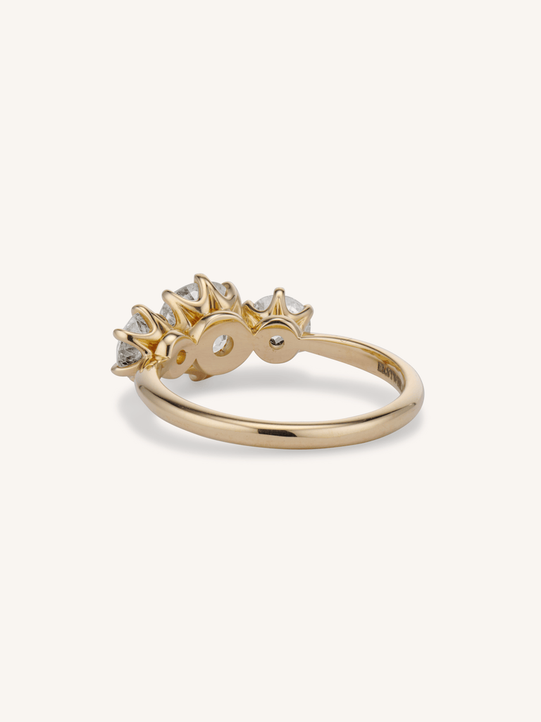 Strela 1.27 old European cut three-stone engagement ring in 18k yellow gold - back