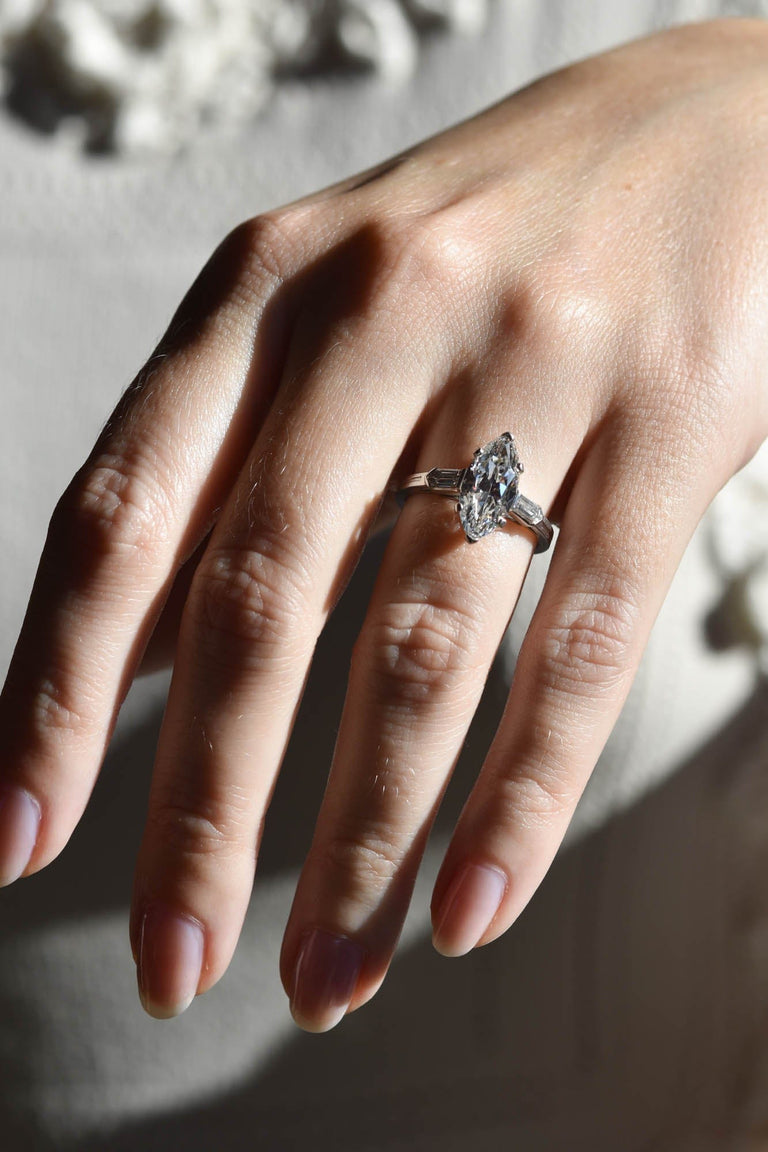 Tiffany & Co. Mid-Century 2.65 Carat Marquise Cut Diamond Vintage Engagement Ring on a hand 2