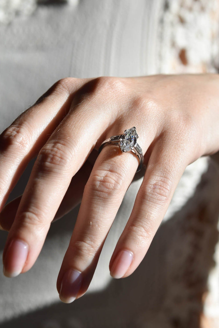 Tiffany & Co. Mid-Century 2.65 Carat Marquise Cut Diamond Vintage Engagement Ring on a hand 3