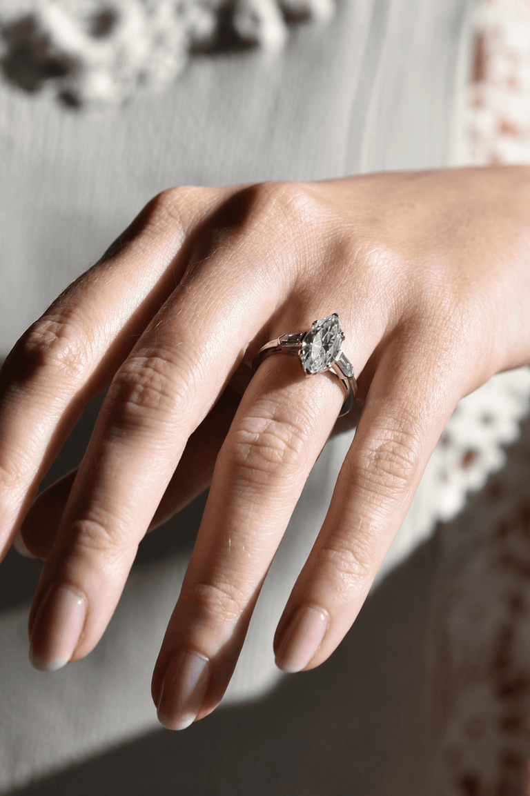 Tiffany & Co. Mid-Century 2.65 Carat Marquise Cut Diamond Vintage Engagement Ring on a hand 3