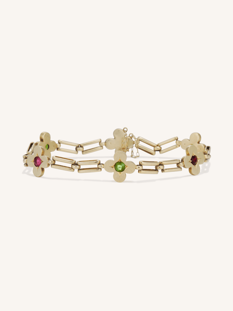Victorian 14K yellow gold bracelet with gem-set clover motifs and open bar links, 19th-century design
