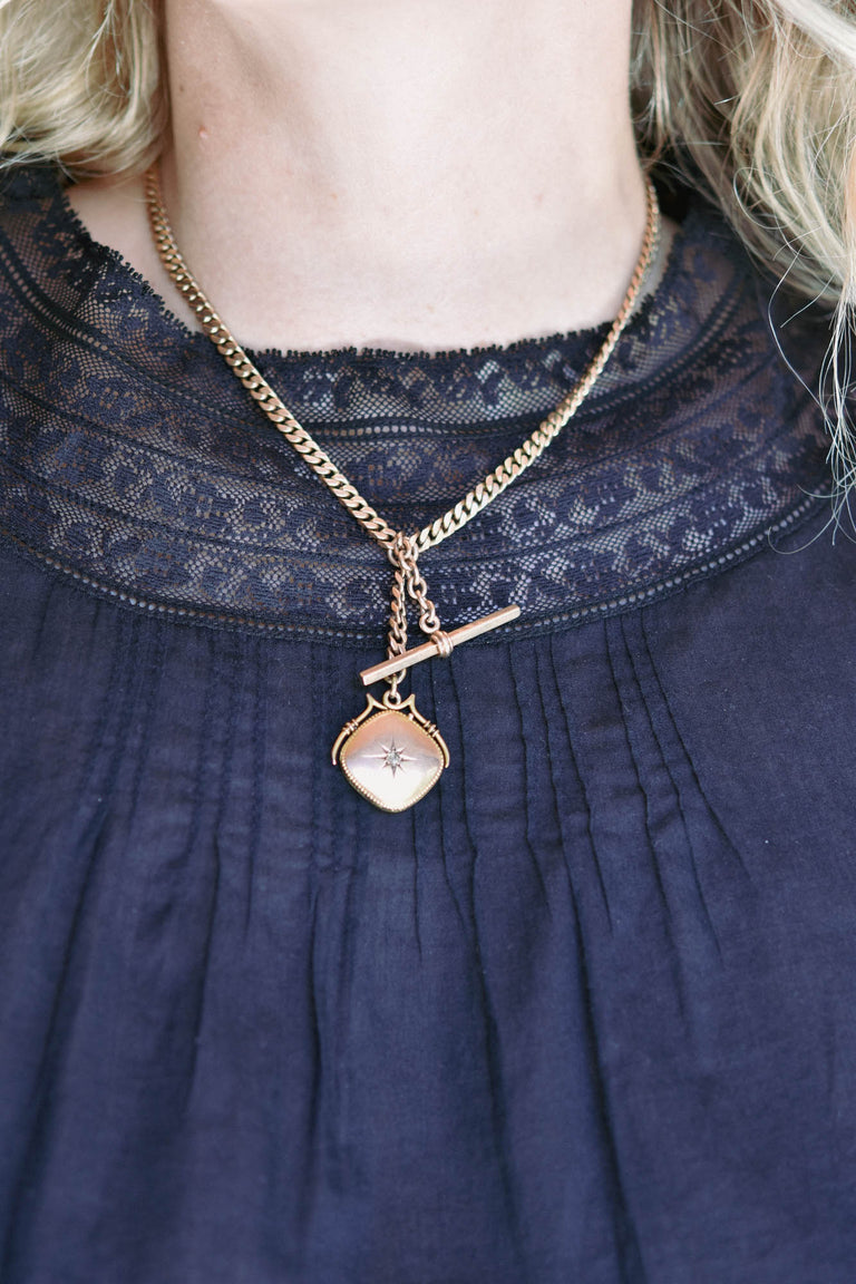 Victorian Gold Locket & Watch Fob Antique Necklace on a model 2