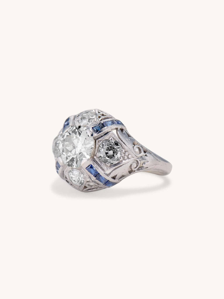 Art Deco 1.25 Carat Old European Cut Diamond and Sapphire Bombé Vintage Engagement Ring