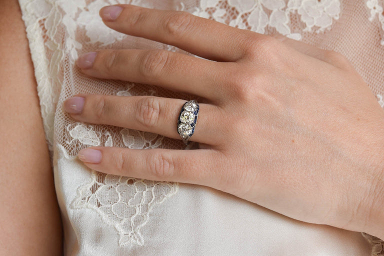 Art Deco three-stone diamond engagement ring with sapphires