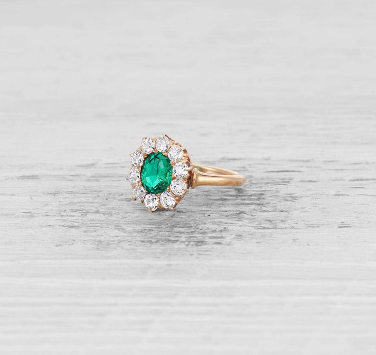 EMERALD AND DIAMOND CLUSTER ENGAGEMENT RING