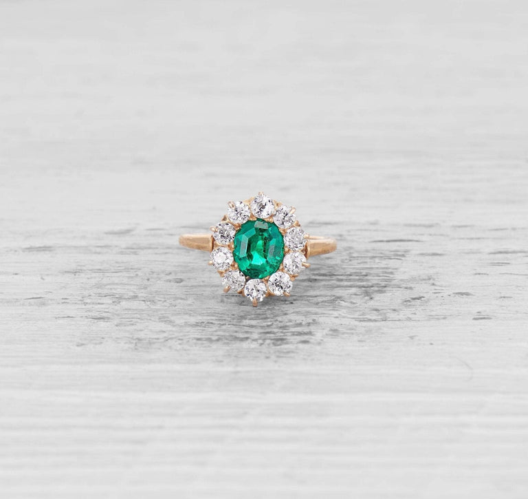 EMERALD AND DIAMOND CLUSTER ENGAGEMENT RING