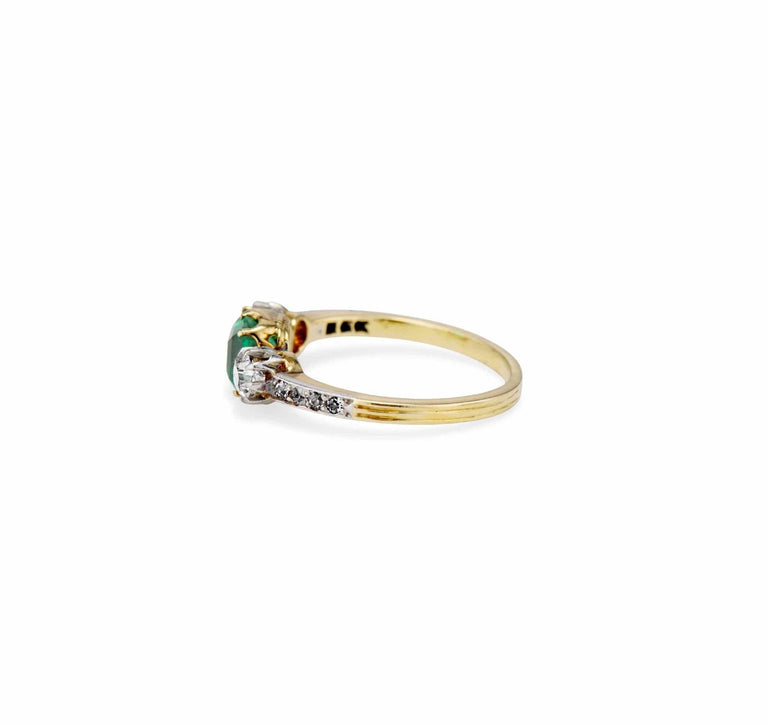 Late Edwardian .71 Carat Colombian Emerald-Cut Emerald and Diamond Three-Stone Ring