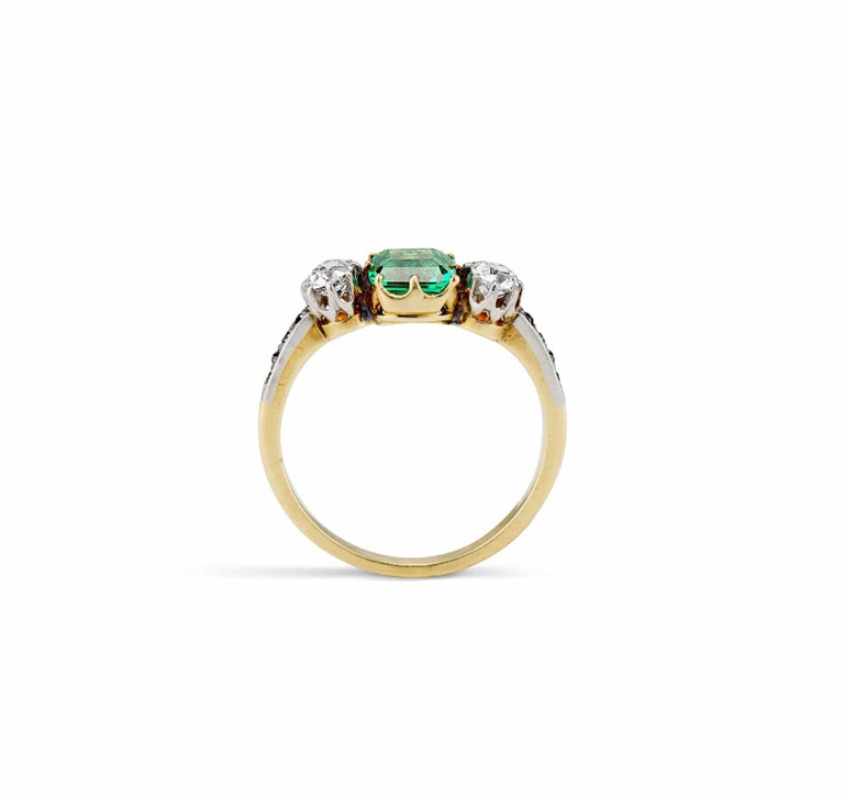 Late Edwardian .71 Carat Colombian Emerald-Cut Emerald and Diamond Three-Stone Ring
