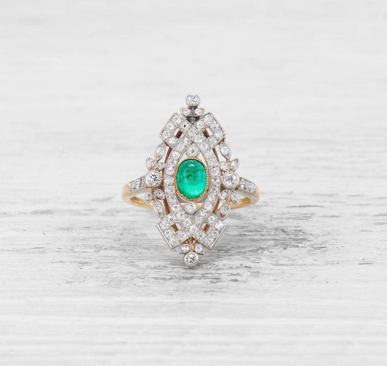 LATE EDWARDIAN EMERALD AND DIAMOND RING