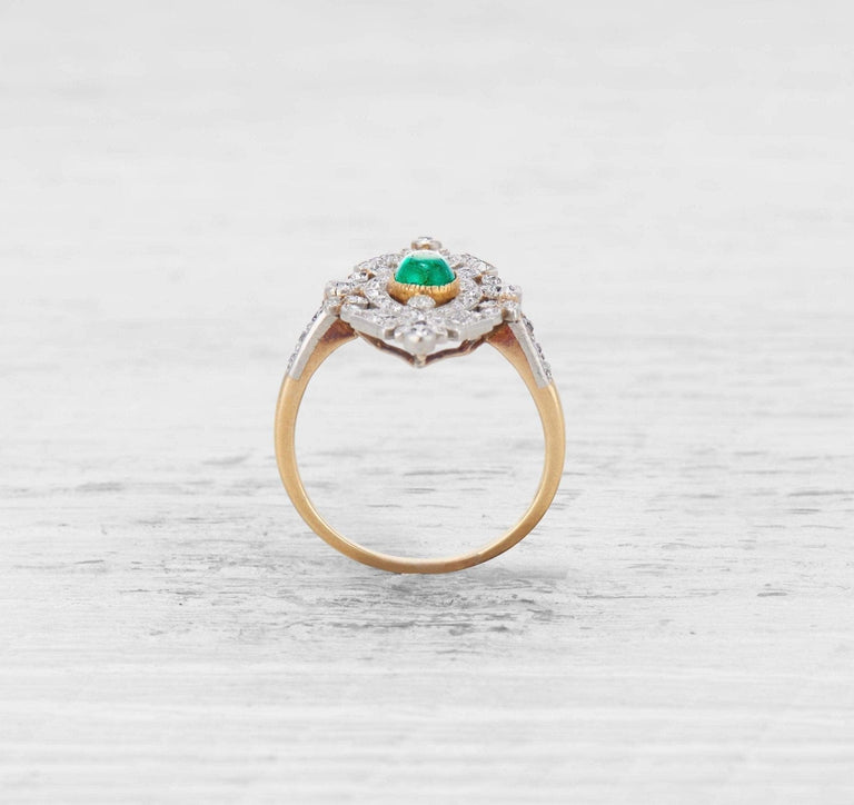 LATE EDWARDIAN EMERALD AND DIAMOND RING