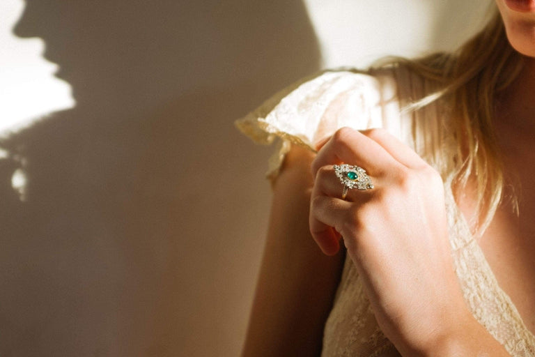 LATE EDWARDIAN EMERALD AND DIAMOND RING