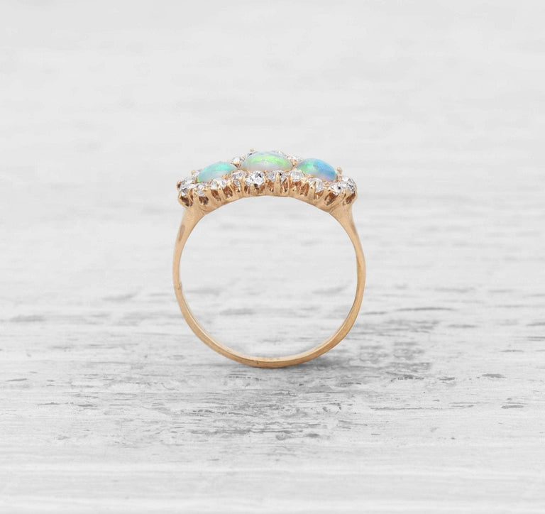 VICTORIAN THREE-STONE OPAL AND DIAMOND ENGAGEMENT RING