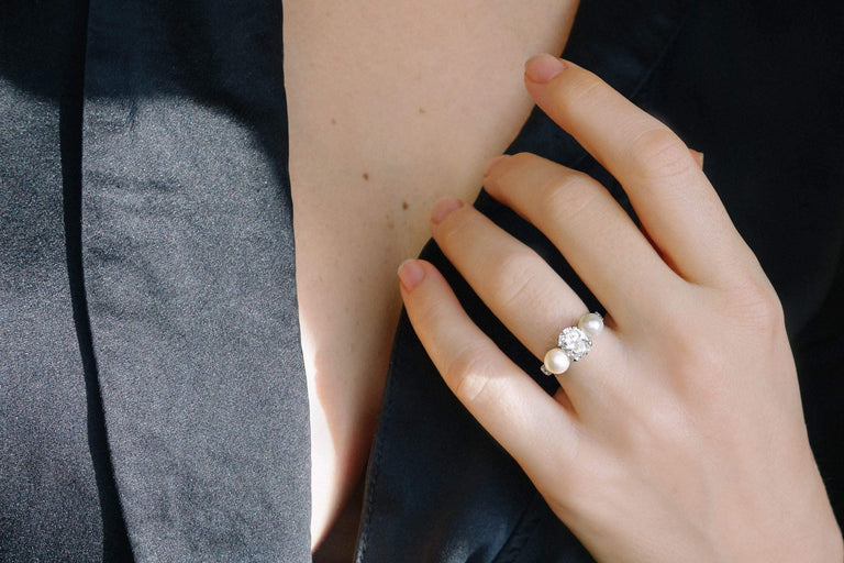 1.29 CARAT EARLY ART DECO DIAMOND AND CULTURED PEARL THREE STONE RING
