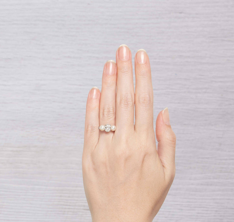1.29 CARAT EARLY ART DECO DIAMOND AND CULTURED PEARL THREE STONE RING